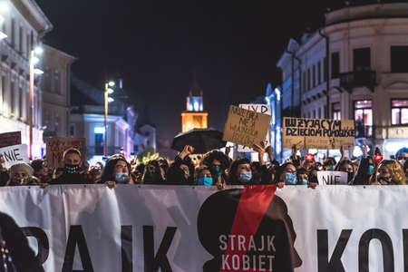 Lublin, Poland - October 23, 2020: People walking the city center during protest (Pogrzeb Praw Kobiet) organized by Strajk Women against abortion ban in Polandのeditorial素材
