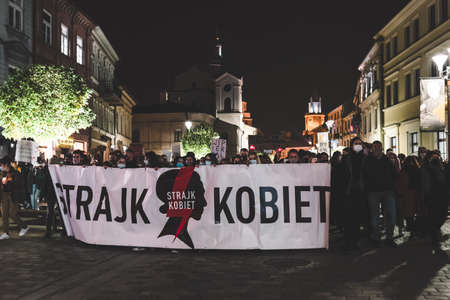 Lublin, Poland - October 23, 2020: People walking the city center during protest (Pogrzeb Praw Kobiet) organized by Strajk Women against abortion ban in Polandのeditorial素材