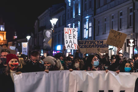 Lublin, Poland - October 23, 2020: People walking the city center during protest (Pogrzeb Praw Kobiet) organized by Strajk Women against abortion ban in Polandのeditorial素材