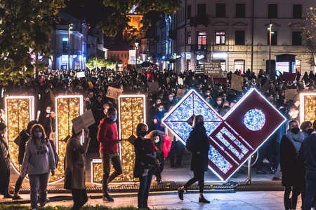 Lublin, Poland - October 23, 2020: People walking the city center during protest (Pogrzeb Praw Kobiet) organized by Strajk Women against abortion ban in Polandのeditorial素材