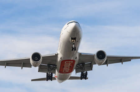 Warsaw, Poland - November 3, 2014: Emirates airlines Boeing 777 landing at Warsaw Chopin Airportのeditorial素材