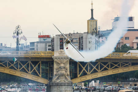 Budapest, Hungary - June 23, 2018: Zivko Edge 540 with smoke on flying near bridge at Red Bull Air Race (The World Air Sports Federation event)のeditorial素材