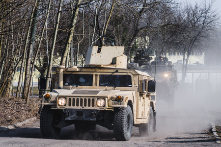 Lublin, Poland - March 25, 2015: United States Army vehicle (Armored Personnel Carrier) Humvee passing city streetsのeditorial素材