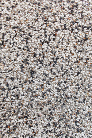 Exterior marble chips. Texture of crushed stone. Background of construction work and finishing from natural building materials.の写真素材