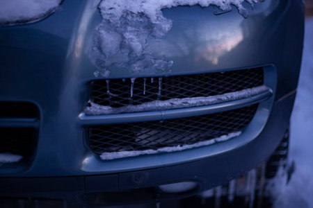 Frozen car bumper, close-up. Winter car service concept.の写真素材