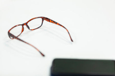 Glasses with case on white background. Copy space, selective focus. Vision problems concept.