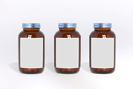 Blank glass medical bottles with tablets pills and label 3d illustrationの写真素材