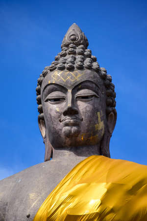 buddha statue and blue sky in thailandの写真素材