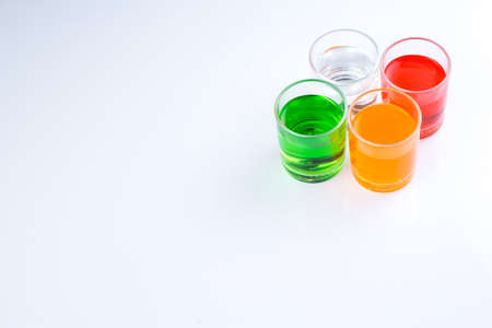 colorful water in the glasses on isolated whiteの写真素材