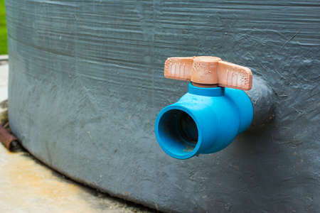 the blue tap of the water tankの写真素材