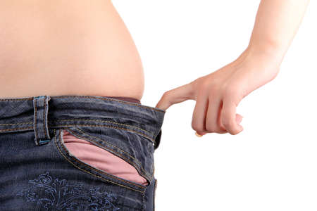 Overweight young girl on a white backgroundの写真素材