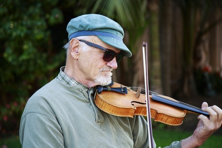 San Diego, California, USA - March 14, 2013  Street violinist performing in Balboa Park on a regular afternoon  Balboa Park is the nation s largest urban cultural park のeditorial素材