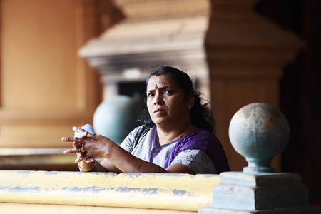 KUALA LUMPUR, MALAYSIA - JUNE 21, 2013  Portrait of an Indian woman in a temple on June 21, 2013 in Batu Caves, Kuala Lumpur, Malaysia  The Batu caves is one of the most popular Hindu shrines outside India のeditorial素材