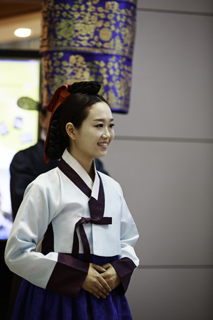 INCHEON, SOUTH KOREA - JULY 01, 2013  Korean woman wearing traditional cloths at Incheon International Airport on July 01, 2013 in South Korea  Incheon Airport is the largest airport in South Korea のeditorial素材