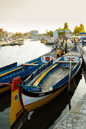 View the traditional moliceiro boats stopped in  the central canal of Aveiro city, in Portugalのeditorial素材