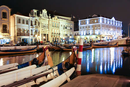 Night view the traditional moliceiro boats stopped in  the central canal of Aveiro city, in Portugalのeditorial素材