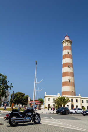 View of Aveiro lighthouse and black bike in foreground in summer, in Aveiro, Portugal, on July 31, 2011のeditorial素材