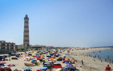 Summer view of Barra beach with the Aveiro lighthouse in background, in Aveiro, Portugal, on July 31, 2011のeditorial素材