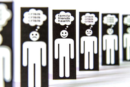 Line of negative paper men symbols thinking about crisis and one positive for the family, friends and healthの写真素材