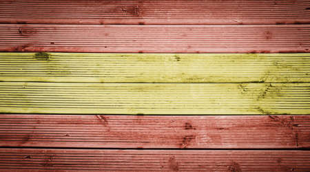 Natural wood planks texture background with the colors of the flag of Spainの写真素材