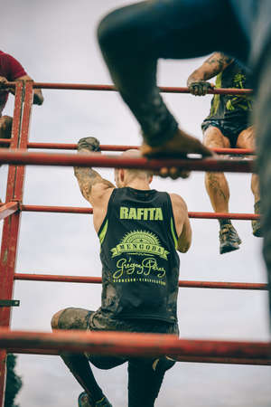 Gijon, Spain - January 31, 2016: Runners into the Farinato Race, a extreme obstacle race, celebrated...