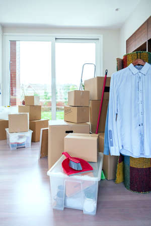 Large living room with stack of moving boxes