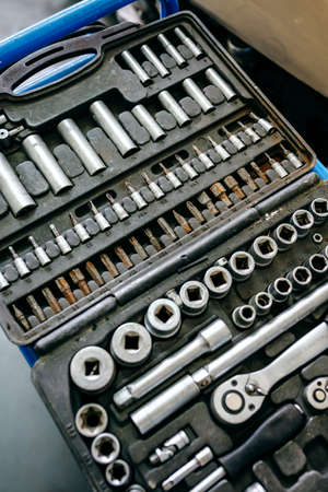 Detail of ratchet wrench tool case in mechanical motorcycle workshop