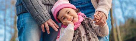 Closeup of happy little girl enjoying with her fathers of leisure in the forest. Family time concept.の写真素材