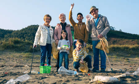 Group of volunteers ready to clean the beachの写真素材