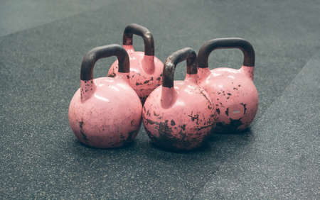 Detail of kettlebells on the floor of a gymの写真素材