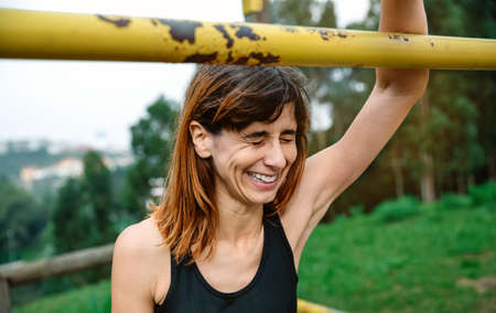 Excited and tired athlete woman after training outdoors