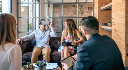 Top view of business people in an informal work meeting using virtual reality glassesの写真素材
