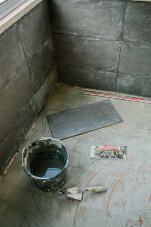 Tile laying work on glazed terrace floorの写真素材