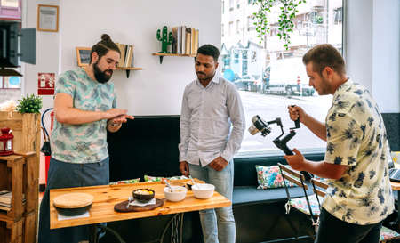 Cook explaining during the recording of a live cooking workshop