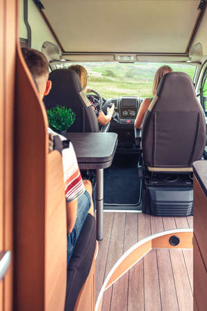 Interior view of unrecognizable friends traveling in camper vanの写真素材