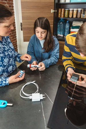 Three people checking 72 hours survival emergency kit supplies with food and water provisions in pantry, emphasizing family preparedness for potential disasters or electrical blackout.の写真素材