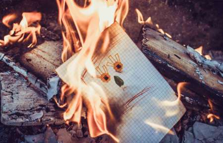 Paper sheet on fire. Flaming paper sheet. Burning paper.の写真素材