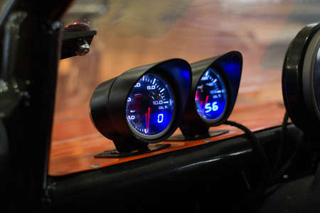 Speedometer of buggy with blue backlight with red cursorの写真素材