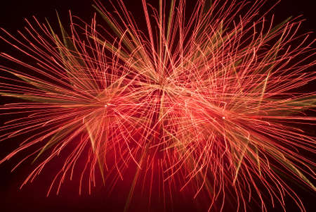 Beautiful red fireworks at the black skyの写真素材