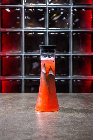 an unusual serving of homemade lemonade in a cafe. soda in a decanterの写真素材