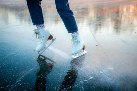 Close-up of ice skates on the ice. Ice skatingの写真素材