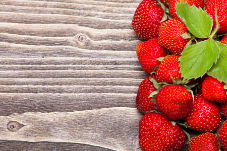 Fresh strawberries on a wooden backgroundの写真素材