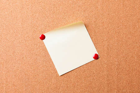 Sticker button pinned on a cork board
