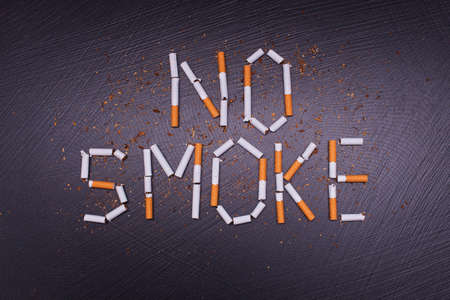 anti-tobacco poster  on dark stone backgroundの写真素材