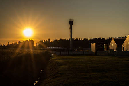 backlight bright rays of red sunset farmの写真素材