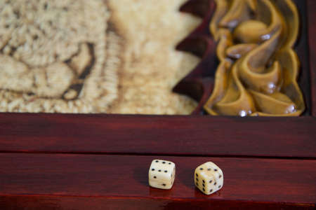 playing dice on a game boardの写真素材