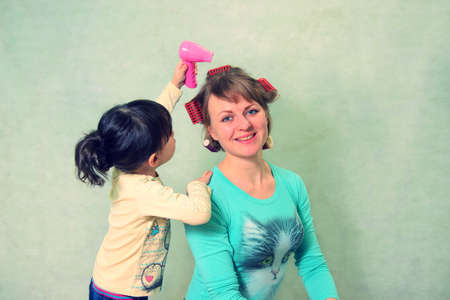 play to the hairdresser. Mom and daughter