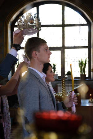 Alchevsk, Ukraine - April 28, 2017: Wedding ceremony of newlyweds in the Christian churchのeditorial素材