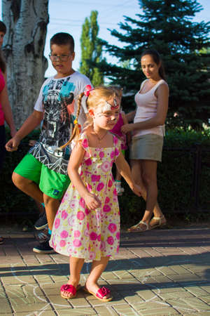 Alchevsk, Ukraine - August 3, 2017 Children's games run around-のeditorial素材
