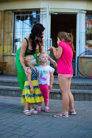 Alchevsk, Ukraine - August 17, 2017: Happy children play with animators in summer.のeditorial素材